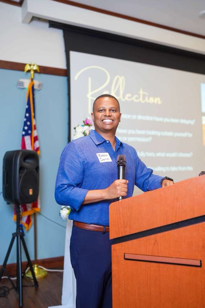 A speaker welcomes and engages the audience.