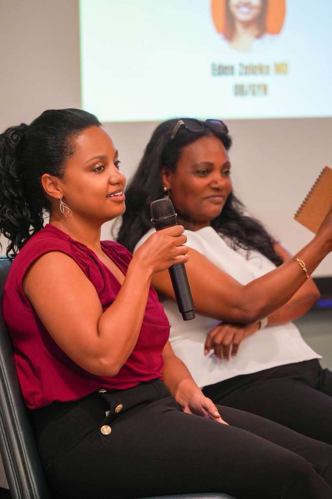 A speaker shares her experience with the audience.